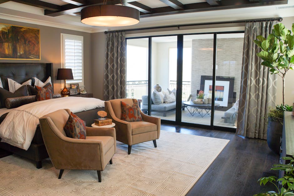 Elegant bedroom in Irvine, CA, featuring luxury decor and balcony access