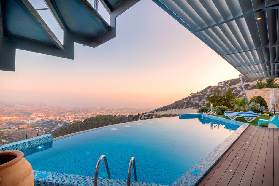 Infinity pool with breathtaking mountain and city views, perfect for a luxury tropical getaway